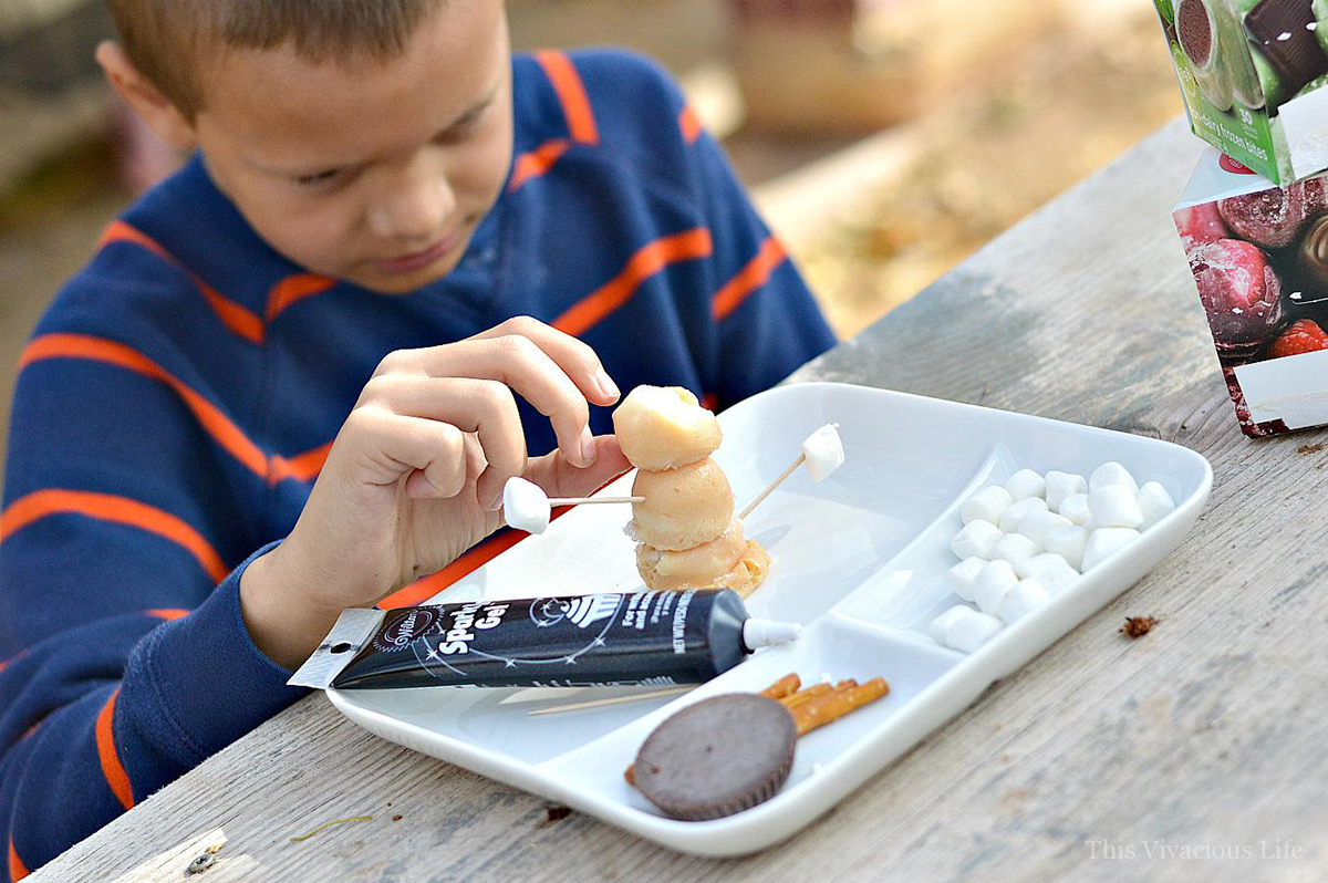 Picture of child assembling edible ice cream snowmen with perfectlyfree® bites
